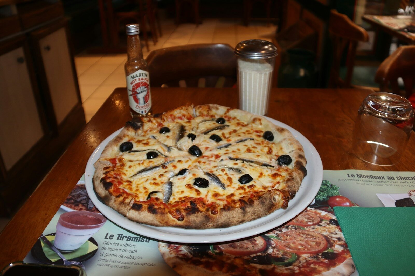 selective focus photography of burger patty, mayonnaise, and French fries served on platter