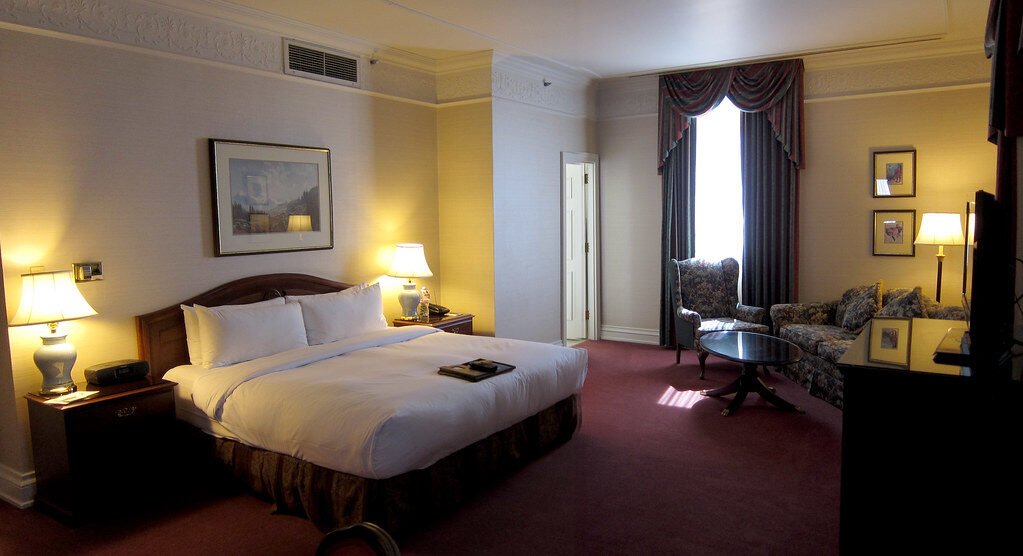 selective focus photography of burger patty, mayonnaise, and French fries served on platter